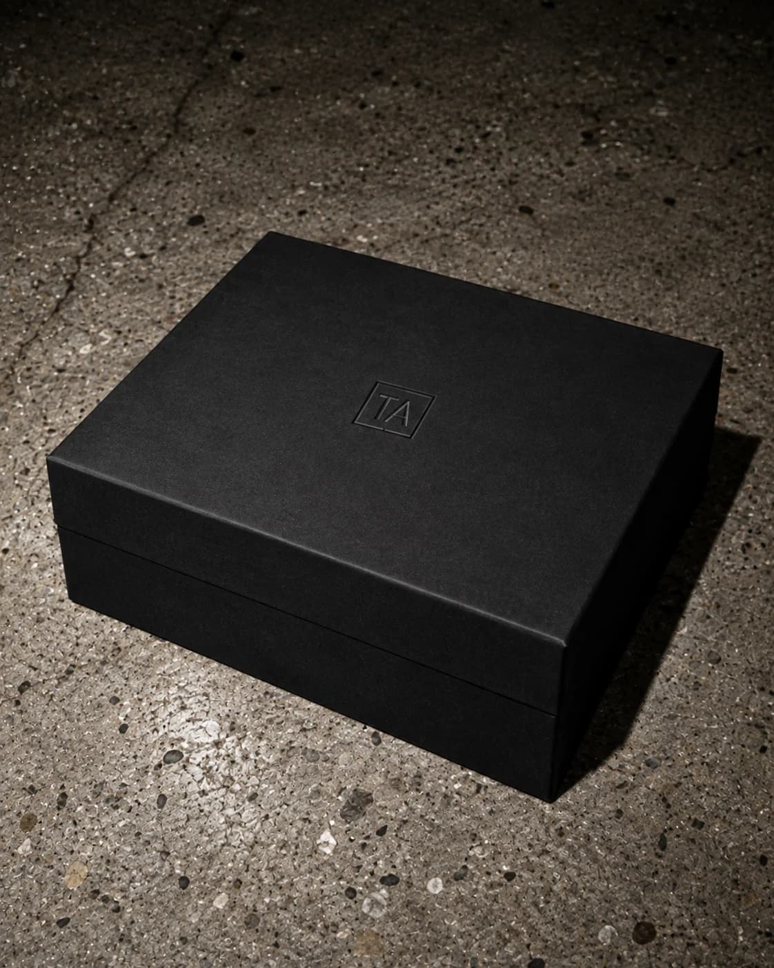 Rigid black box, blind-embossed TA